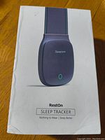 Front view of retail packaging showing the Sleepace RestOn Sleep Tracker device with branding and product image.