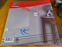 Front of the boxed Health Rite Wall Convection Panel Heater showing brand, model, and wattage.
