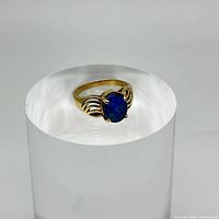 Front view showing oval opal gemstone and setting