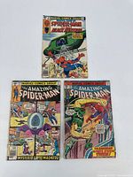 Three Spider-Man comic books shown together, illustrating the lot contents with various cover art.