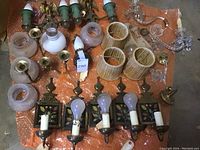 Overview of assorted fixture parts on orange bubble wrap