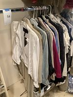 Rack view of multiple garments hanging