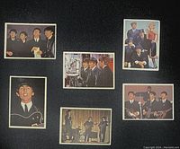 Photo of six Beatles Diary trading cards showing front side with various Beatles images including group portraits and stage performance.