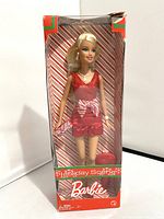 Full view of boxed 2008 Holiday Scene Barbie doll with box showing wear and damage.