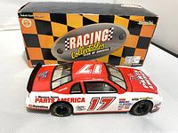 Top angled view of the red and white Dale Waltrip Parts America 1:24 scale racing car with original box behind it, showing car number 17 and sponsor logos