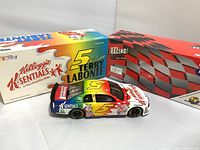 Terry Labonte #5 Kellogg's K-Sentials limited edition 1:24 scale stock car bank alongside original packaging boxes.