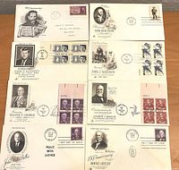 Front side of 10 first day issue envelopes featuring historical figures and anniversaries with printed cachets, stamps, and postmarks.
