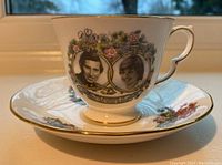 Teacup and saucer set showing full design and scalloped rim