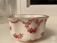 Rose Garland bone china sugar dish with garland floral design and gold rim showing slight chip and stained interior