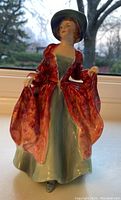 Front view of Royal Doulton figurine “Margaret” showing detailed dress and face.
