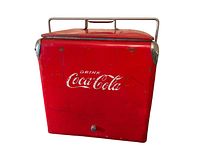 Front view of red Coca Cola metal cooler showing logo, metal handle, and lid with minor wear and scratches.