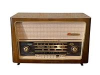 Front view of radio showing dial, knobs, push buttons, and cabinet condition