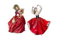 Two Royal Doulton figurines on black surface, showing full view of both figures