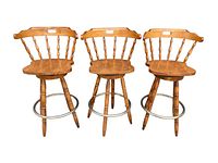 Three stools on white background, front view
