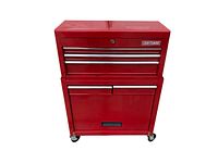 Front view of red Craftsman two-piece rolling tool chest (top chest attached to bottom cabinet) on concrete.