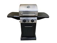 Front view of Master Chef Elite 2-burner BBQ grill with closed lid, showing stainless steel hood, thermometer, two control knobs, base cabinet and side shelves.