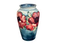 Front view of the ceramic vase showing the blue-green glaze and red anemone flowers in raised detail
