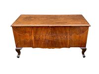 Front view of the vintage Simpsons walnut chest showing front panel design, legs, and overall finish.