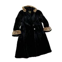 Black long winter coat with brown fur trim on collar and cuffs, laid flat view