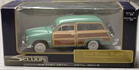 Front and side view of boxed 1/38 scale green and wood panel 1949 Ford Woody Wagon diecast model