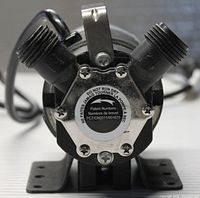 Front view showing two angled garden hose threaded fittings, patent number label, and metal handle lever on top.