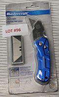 Front view of Mastercraft utility knife in original packaging showing product and replacement blades.