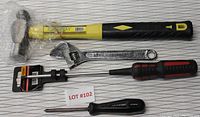 Photo showing ball peen hammer, 8-inch adjustable wrench, used Mastercraft Phillips screwdriver, and long Phillips screwdriver by Toolway in packaging