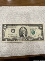 Front side view of the 1976 US two dollar bill showing full design and condition