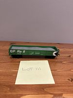 Full side view of green CP Rail coal car number 5322 showing white lettering and simulated coal load inside