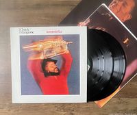 Photo of the album cover of Chuck Mangione's Tarantella and the two vinyl records and inner sleeves partially visible.