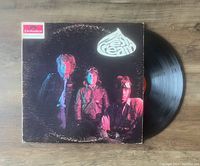 Vinyl LP record with album cover and black vinyl disc mostly visible, showing the band members and the Cream logo.