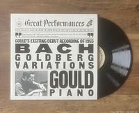 Vinyl record partially pulled from original LP jacket cover. Cover shows text and photo of Glenn Gould at piano with large BACH GOLDBERG VARIATIONS text.