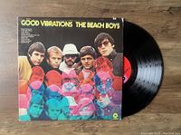 Vinyl LP of The Beach Boys Good Vibrations album with front cover visible and part of the record showing.