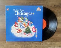 The Care Bears Christmas vinyl LP with original illustrated album cover and black record with orange center label.