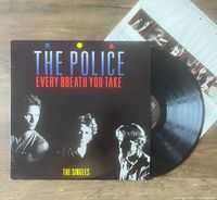 Front cover of The Police 'Every Breath You Take' vinyl album showing band members and title typography.