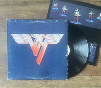 Photo showing Van Halen II album cover, vinyl disc, and illustrated inner sleeve with band figurines.