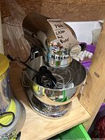 Front view of KitchenAid Ultra Power stand mixer in chrome with bowl and power cord