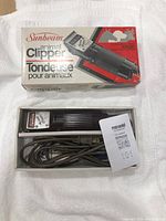 Sunbeam animal clipper unit in original box with power cord visible.