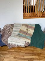 Woven rugs draped over furniture showing colors and texture