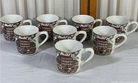 Set of 8 Johnson Bros Heritage Hall ironstone coffee/tea mugs arranged in a group on a light surface.