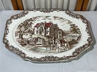 Full view of the large oval ironstone platter with a Victorian Gothic country house scene and detailed border.