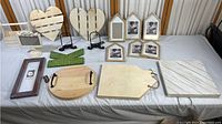 All lot items displayed, wood hearts, frames, trays, caddy, and chalkboard stand.