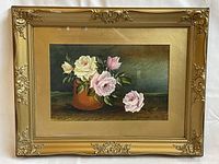 Frontal photo of the complete gilt frame and watercolour painting showing the floral still life
