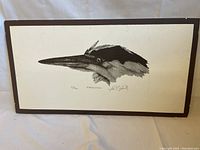 Framed black and white print showing the entire artwork and frame.