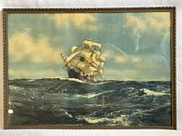 Full frontal view of the gilt-framed vintage print showing a sailing ship on the ocean.