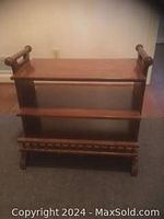 Front view of the Lane solid wood server cart showing two open shelves and top shelf with side handles.