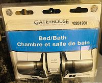Photo of Gate House Bed/Bath bedroom door knob set in retail packaging showing product and packaging details.