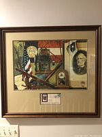 Full view of framed Georgia bicentennial stamp and artwork piece showing historical images and mounted signed envelope.