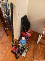 Group photo of all items including dumbbells, resistance band, bathroom scale, hair dryer, two humidifiers, and lumbar back pillow.