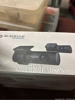 Front of sealed box showing BlackVue logo, model DR750S-2CH and product image